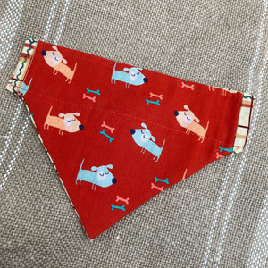 Red Dog Bandana - reversible, handmade from cotton featuring cartoon dogs on a red background